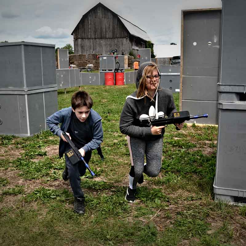 Kids running on the laser tag field